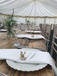 Rustic trestle tables with limewash chivari chairs
