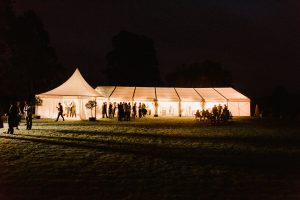 Framed marquee with a 6m Oriental canopy Chinese hat as a porchway entrance  at night